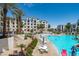 Expansive community pool area offers plenty of seating and shade, perfect for relaxation at 2511 W Queen Creek Rd # 116, Chandler, AZ 85248