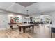 Spacious game room offers a pool table and shuffle board, ideal for community entertainment at 2511 W Queen Creek Rd # 116, Chandler, AZ 85248