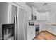 This kitchen features stainless steel appliances, white cabinets, and modern countertops at 2511 W Queen Creek Rd # 116, Chandler, AZ 85248
