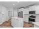 An open-concept kitchen with an island and stainless steel appliances at 2511 W Queen Creek Rd # 116, Chandler, AZ 85248