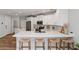 Bright kitchen with an island, stainless steel appliances, and bar stool seating at 2511 W Queen Creek Rd # 116, Chandler, AZ 85248