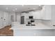 An open-concept kitchen with an island and stainless steel appliances at 2511 W Queen Creek Rd # 116, Chandler, AZ 85248
