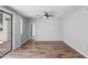 The living room features wood flooring and access to the patio at 2511 W Queen Creek Rd # 116, Chandler, AZ 85248