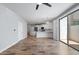 Open concept living room with an open view to the kitchen and access to the patio at 2511 W Queen Creek Rd # 116, Chandler, AZ 85248