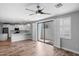 A spacious living room is featured with natural light and access to the kitchen at 2511 W Queen Creek Rd # 116, Chandler, AZ 85248