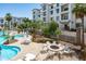 Relaxing pool area featuring a cozy fire pit with seating, perfect for entertaining and lounging at 2511 W Queen Creek Rd # 116, Chandler, AZ 85248