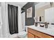 Stylishly decorated bathroom with dark accent wall and modern vanity at 2738 E Silversmith Trl, San Tan Valley, AZ 85143