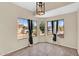 Bright breakfast nook with large windows and neutral color palette offers neighborhood views at 2738 E Silversmith Trl, San Tan Valley, AZ 85143