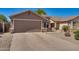 Beautiful home featuring a two-car garage, desert landscaping, and a well-maintained driveway at 2738 E Silversmith Trl, San Tan Valley, AZ 85143