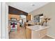 Well-designed kitchen with tile backsplash, modern appliances, and an open view to the dining area at 2738 E Silversmith Trl, San Tan Valley, AZ 85143