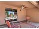 Covered patio with ceiling fan, neutral colors, and view of the backyard at 2738 E Silversmith Trl, San Tan Valley, AZ 85143