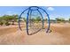 Unique climbing dome in a well maintained community park with established trees at 2738 E Silversmith Trl, San Tan Valley, AZ 85143