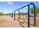 Blue swings in a well-kept community park with mature trees and landscaping at 2738 E Silversmith Trl, San Tan Valley, AZ 85143