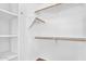 Walk-in closet features white shelving and wood closet rod at 2738 E Silversmith Trl, San Tan Valley, AZ 85143