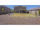 Expansive backyard featuring a well-manicured lawn, patio, and desert landscaping at 29474 W Columbus Ave, Buckeye, AZ 85396