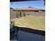 Backyard with green lawn and rock landscaping at 29474 W Columbus Ave, Buckeye, AZ 85396