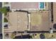 Expansive backyard features low maintenance landscaping, surrounded by secure fencing with a neighboring pool visible at 29474 W Columbus Ave, Buckeye, AZ 85396