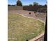 The backyard features a grass lawn with an outdoor play structure at 29474 W Columbus Ave, Buckeye, AZ 85396