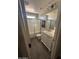 Bright bathroom showcasing a shower-tub combo and stylish vanity with a white marble countertop at 29474 W Columbus Ave, Buckeye, AZ 85396