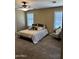 Cozy bedroom with soft carpet, neutral walls, and comfortable bedding at 29474 W Columbus Ave, Buckeye, AZ 85396