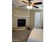 Bedroom featuring a corner fireplace, ceiling fan, and a neutral color palette at 29474 W Columbus Ave, Buckeye, AZ 85396