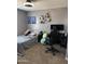 This bedroom has a gaming chair, desk, and other furniture at 29474 W Columbus Ave, Buckeye, AZ 85396