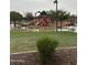 A colorful playground and recreation area with benches in a well-maintained community park at 29474 W Columbus Ave, Buckeye, AZ 85396