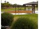This community park features a covered picnic area with benches and swings at 29474 W Columbus Ave, Buckeye, AZ 85396
