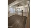 Dining room with wood floors, a modern chandelier, and a large china cabinet at 29474 W Columbus Ave, Buckeye, AZ 85396