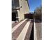 Wide driveway with gravel accents leading to a secure gate at 29474 W Columbus Ave, Buckeye, AZ 85396