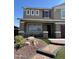 Inviting home with front porch and detailed landscaping enhances curb appeal at 29474 W Columbus Ave, Buckeye, AZ 85396