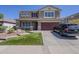 Beautiful two-story home with a well-manicured lawn and attached two-car garage at 29474 W Columbus Ave, Buckeye, AZ 85396