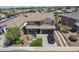 Inviting two-story home showcasing manicured landscaping, a cozy porch, and a convenient attached two-car garage at 29474 W Columbus Ave, Buckeye, AZ 85396