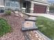 Beautifully landscaped front yard with stone accents and a paved walkway at 29474 W Columbus Ave, Buckeye, AZ 85396