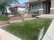 Green lawn with stone walkway leading to a charming front porch at 29474 W Columbus Ave, Buckeye, AZ 85396