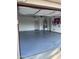 Spacious three-car garage with epoxy floors and plenty of storage at 29474 W Columbus Ave, Buckeye, AZ 85396