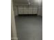 Empty garage with sealed concrete floor and automatic door opener at 29474 W Columbus Ave, Buckeye, AZ 85396