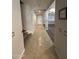 Hallway with a staircase to the left leads into an open living area at 29474 W Columbus Ave, Buckeye, AZ 85396