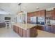Bright kitchen with a large center island, stainless steel appliances, and modern finishes at 29474 W Columbus Ave, Buckeye, AZ 85396
