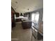 Spacious kitchen with stainless steel appliances and large island with granite countertops at 29474 W Columbus Ave, Buckeye, AZ 85396