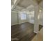 Bright living room with coffered ceiling, hardwood floors, and natural light at 29474 W Columbus Ave, Buckeye, AZ 85396