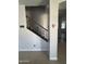 Staircase with decorative wrought iron railing that leads to the upper level of the home at 29474 W Columbus Ave, Buckeye, AZ 85396