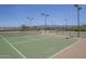 Community tennis courts with fencing, lighting, and mountain views at 29474 W Columbus Ave, Buckeye, AZ 85396