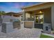 Outdoor patio featuring a built-in barbecue area, ideal for entertaining and enjoying outdoor living at 30308 W Whitton Ave, Buckeye, AZ 85396