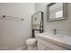 This bathroom features a modern sink, toilet, and mirror at 30308 W Whitton Ave, Buckeye, AZ 85396