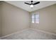 This bedroom boasts a window and a modern ceiling fan at 30308 W Whitton Ave, Buckeye, AZ 85396