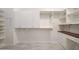 Spacious walk-in closet equipped with custom shelving, cabinets, drawers, and ample storage for clothing and accessories at 30308 W Whitton Ave, Buckeye, AZ 85396