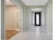 Bright entryway with a decorative front door and marble-patterned tile flooring at 30308 W Whitton Ave, Buckeye, AZ 85396