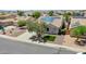 Single-Gathering home with solar panels, desert landscaping, and a well-manicured lawn at 30308 W Whitton Ave, Buckeye, AZ 85396