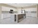 Bright kitchen featuring white cabinets, stainless steel appliances and center island at 30308 W Whitton Ave, Buckeye, AZ 85396